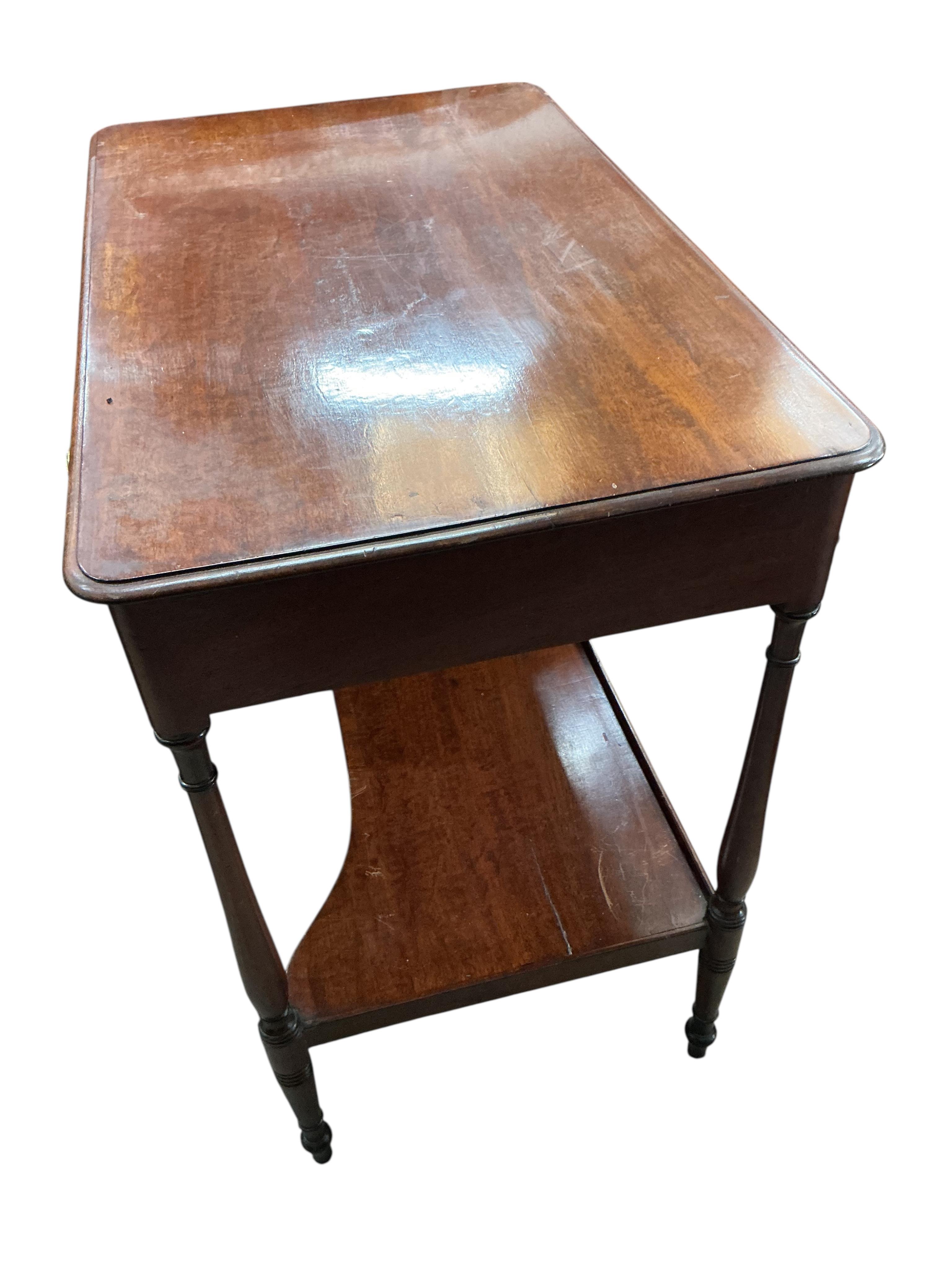 A small Victorian mahogany dressing table, with slender ring turned legs and undertier, width 74cm, depth 45cm, height 75cm